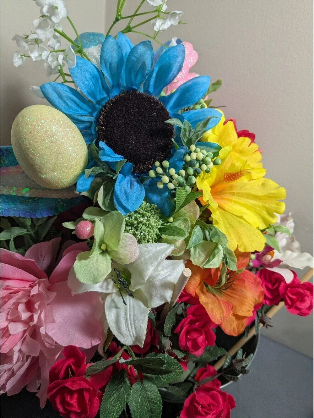 Artificial Flower Arrangement with Decorative Greenery and Shredded Paper Filler